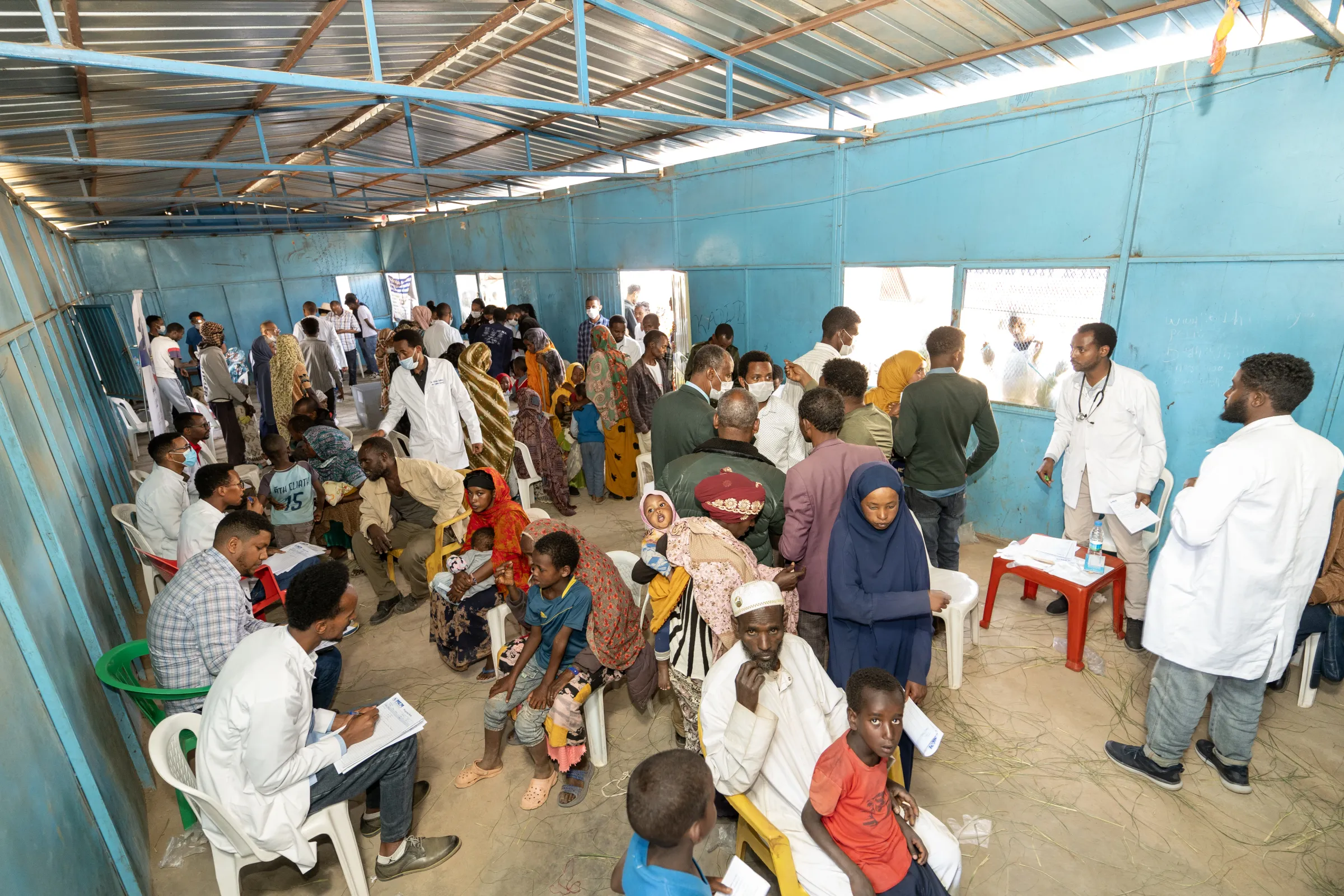 Patients waiting to be seen at an MCM mobile clinic